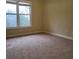 Neutral bedroom with carpet, white trim, and a window offering natural light at 1755 Riverpark Dr, Dacula, GA 30019