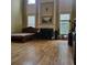 Bedroom with a large bed, fireplace, hardwood floors and lots of natural light at 1755 Riverpark Dr, Dacula, GA 30019