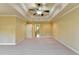 Main bedroom boasts a trey ceiling, neutral decor and adjacent bathroom at 1755 Riverpark Dr, Dacula, GA 30019