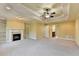 Open main bedroom offers a tray ceiling, fireplace and adjoining bathroom at 1755 Riverpark Dr, Dacula, GA 30019
