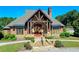 A detailed shot of clubhouse featuring stone facade, manicured landscaping, and inviting entryway at 1755 Riverpark Dr, Dacula, GA 30019
