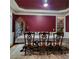 Formal dining room features a large table with decorative chairs and an elegant china cabinet at 1755 Riverpark Dr, Dacula, GA 30019
