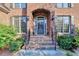 Inviting brick entryway with decorative black iron railings and mature shrubs at 1755 Riverpark Dr, Dacula, GA 30019