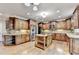 Spacious kitchen featuring custom cabinetry, a center island, stainless steel appliances, and hardwood floors at 1755 Riverpark Dr, Dacula, GA 30019