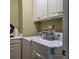 Bright laundry room includes modern washer and dryer units, with ample cabinet space at 1755 Riverpark Dr, Dacula, GA 30019