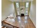 Bright living room showcasing hardwood floors, a soaring ceiling, large windows, and a cozy fireplace at 1755 Riverpark Dr, Dacula, GA 30019