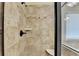 Tile shower with glass door and seat at 1755 Riverpark Dr, Dacula, GA 30019
