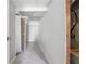 Hallway with tile floors and door leading to another room at 1926 Camellia Dr, Decatur, GA 30032