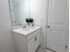 Elegant bathroom features a modern sink, vanity and bright white door at 4320 Sims Park Overlook, Suwanee, GA 30024