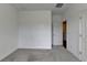 Bedroom featuring gray carpeting, white walls, and two doors at 4320 Sims Park Overlook, Suwanee, GA 30024