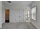 Bedroom with gray carpeting, white walls, closet, and an ensuite bath at 4320 Sims Park Overlook, Suwanee, GA 30024