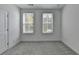 Clean bedroom with plush gray carpet, crisp white walls, and bright window lighting at 4320 Sims Park Overlook, Suwanee, GA 30024