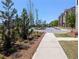 Well-maintained community featuring lush landscaping, sidewalks, and attractive townhomes at 4320 Sims Park Overlook, Suwanee, GA 30024