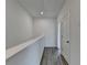 Hallway featuring neutral walls, hard flooring, and white door at 4320 Sims Park Overlook, Suwanee, GA 30024