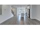 Open-concept living space featuring a modern kitchen and hardwood floors throughout at 4320 Sims Park Overlook, Suwanee, GA 30024