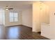 Living room featuring hardwood floors, white walls, and modern lighting at 4320 Sims Park Overlook, Suwanee, GA 30024
