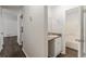 Bright bathroom featuring a single sink vanity, granite countertops, and a tub and shower combo at 3025 Creel Rd, Atlanta, GA 30349