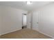 Carpeted bedroom featuring two entryways, neutral paint, and modern lighting at 3025 Creel Rd, Atlanta, GA 30349