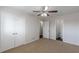 Spacious bedroom with carpet flooring, a ceiling fan, and a walk-in closet at 3025 Creel Rd, Atlanta, GA 30349