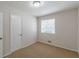 Bright bedroom with carpet flooring, a window with blinds, and neutral paint at 3025 Creel Rd, Atlanta, GA 30349