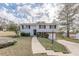 Charming split-level home with stone accents, landscaped yard, and single-car garage at 3025 Creel Rd, Atlanta, GA 30349