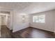 Open-concept living area with new dark hardwood flooring and neutral walls at 3025 Creel Rd, Atlanta, GA 30349