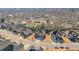 Aerial view of a residential neighborhood with well-maintained homes and green spaces in a suburban setting at 5315 Hidden Valley Ln, Cumming, GA 30028