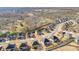 A neighborhood showcasing homes with uniform landscaping, driveways and well manicured lawns at 5315 Hidden Valley Ln, Cumming, GA 30028