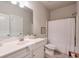 Clean, well-lit bathroom with a single sink vanity and combined tub and shower at 5315 Hidden Valley Ln, Cumming, GA 30028