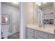 Well-lit bathroom with a modern vanity, a stylish mirror, and a toilet at 5315 Hidden Valley Ln, Cumming, GA 30028