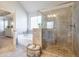 Spa-like bathroom with a glass-enclosed shower, separate soaking tub, and neutral tile at 5315 Hidden Valley Ln, Cumming, GA 30028