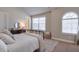 Charming bedroom with a wrought iron bed frame, a window seat, and a bright, airy feel at 5315 Hidden Valley Ln, Cumming, GA 30028
