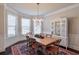 Elegant dining room featuring a chandelier, bay window, and wooden table at 5315 Hidden Valley Ln, Cumming, GA 30028