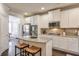 Bright kitchen with a center island, stainless steel appliances, and white cabinetry at 5315 Hidden Valley Ln, Cumming, GA 30028