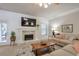 The living room features shiplap walls, a stone fireplace, a comfortable couch, and a wooden coffee table at 5315 Hidden Valley Ln, Cumming, GA 30028
