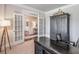 Bright office with french doors, a large desk, and stylish decor at 5315 Hidden Valley Ln, Cumming, GA 30028