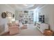 Cozy sitting area with built-in bookshelves, comfortable chairs, and stylish decor at 5315 Hidden Valley Ln, Cumming, GA 30028