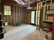 Unfinished basement with concrete floors and a walkout entrance at 6245 Bannister Rd, Cumming, GA 30028