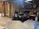 Unfinished basement space with exposed brick and wooden framing for customization at 6245 Bannister Rd, Cumming, GA 30028
