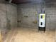 Spacious unfinished basement with block walls, ideal for storage or customization at 6245 Bannister Rd, Cumming, GA 30028