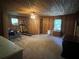 Upstairs bonus room with a ceiling fan, and wood paneled walls at 6245 Bannister Rd, Cumming, GA 30028