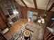 Cozy living room with stone fireplace, wood beams and hardwood floors at 6245 Bannister Rd, Cumming, GA 30028