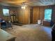 A wood paneled living room with carpet at 6245 Bannister Rd, Cumming, GA 30028