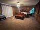 Spacious main bedroom features wood paneling and plush carpeting at 6245 Bannister Rd, Cumming, GA 30028