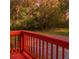 Backyard featuring a red deck and gravel path at 7880 Rivertown Rd, Atlanta, GA 30213