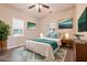 Cozy bedroom featuring hardwood floors, a ceiling fan, and inviting decor for a comfortable retreat at 7880 Rivertown Rd, Atlanta, GA 30213