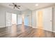 Spacious main bedroom featuring hardwood floors, walk-in closet, and en-suite bathroom at 7880 Rivertown Rd, Atlanta, GA 30213