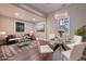 An inviting dining room and living room combination featuring hardwood floors and an elegant chandelier at 7880 Rivertown Rd, Atlanta, GA 30213