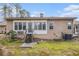 View of house backyard featuring a small set of steps leading to a door at 4203 Jordans Bank, Union City, GA 30291