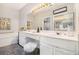 Bright bathroom featuring double sinks, white cabinetry, and a large mirror at 4203 Jordans Bank, Union City, GA 30291